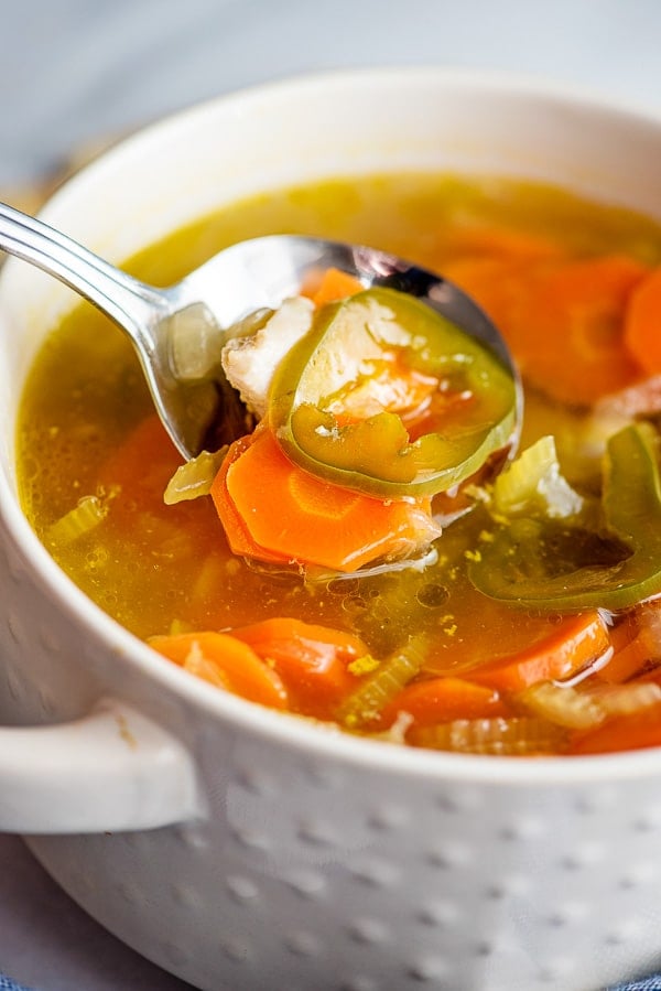 close up of homemade chicken and vegetable soup with jalapenos