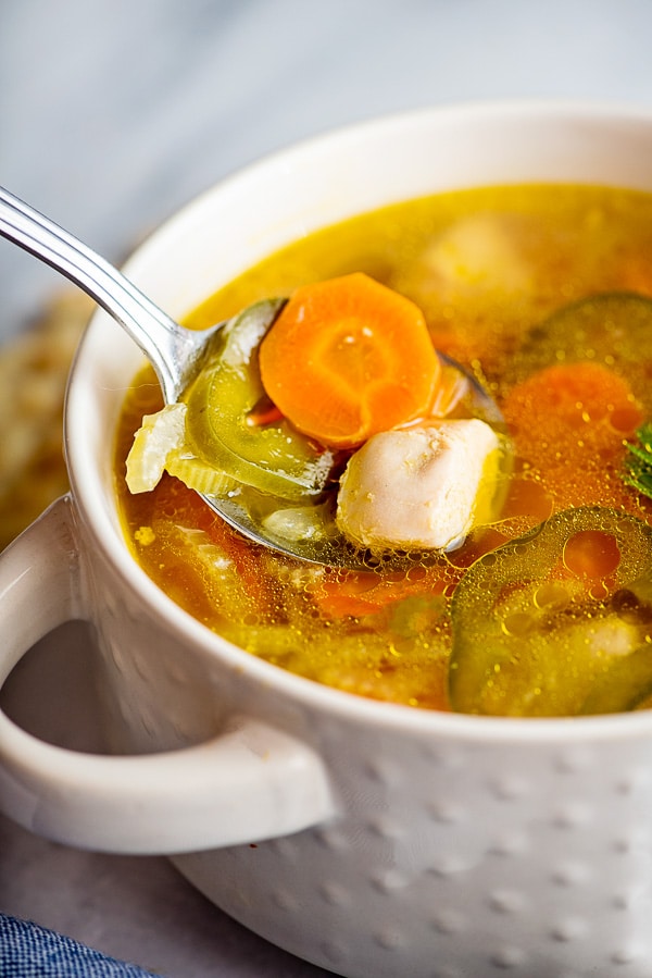 spoonful of chicken soup with vegetables 