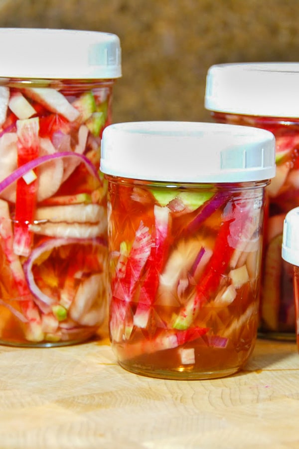 Jars of quick pickled Watermelon Radishes (refrigerator pickles)