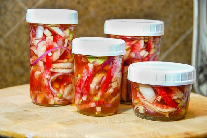 Four prepared jars of Watermelon Radish Pickles