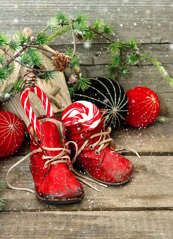 red boots with candy canes and christmas ornaments