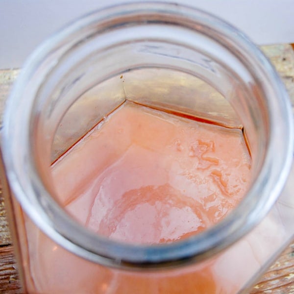 Homemade apple cider vinegar jar with vinegar mother