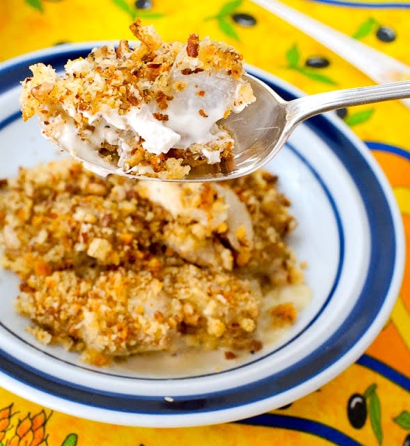 white and blue plate of Creamy Ginger Scalloped Sunchokes and close up on a spoonful of it