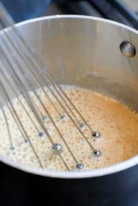 whisking in flour to melted butter