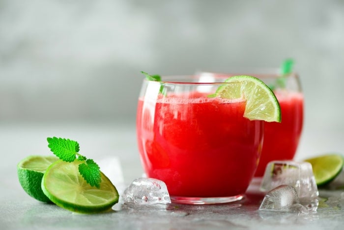 Watermelon margaritas with lime slices