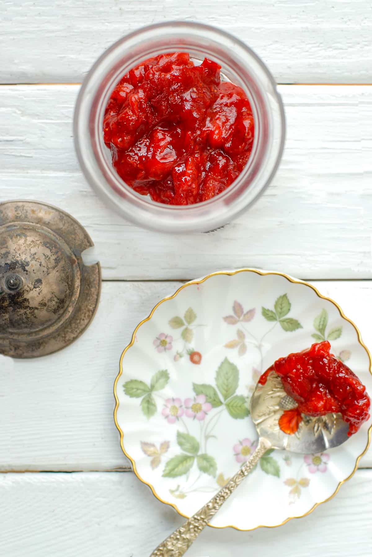 homemade strawberry jam on spoon with jar