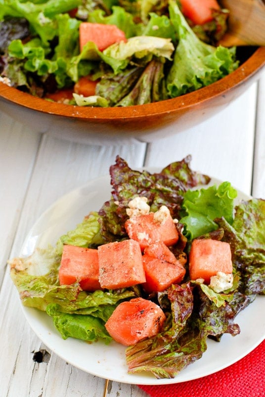 watermelon goat cheese salad single serving on a white plate