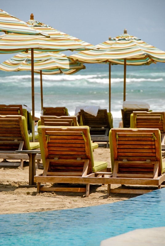 Beach chairs and striped umbrellas at JW Marriott Guanacaste Costa Rica