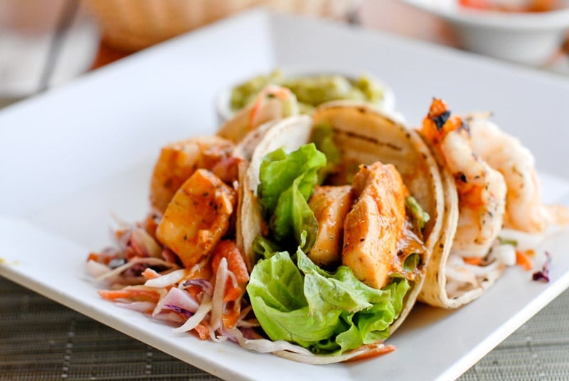 trio of fresh fish tacos on a white plate in Costa Rica