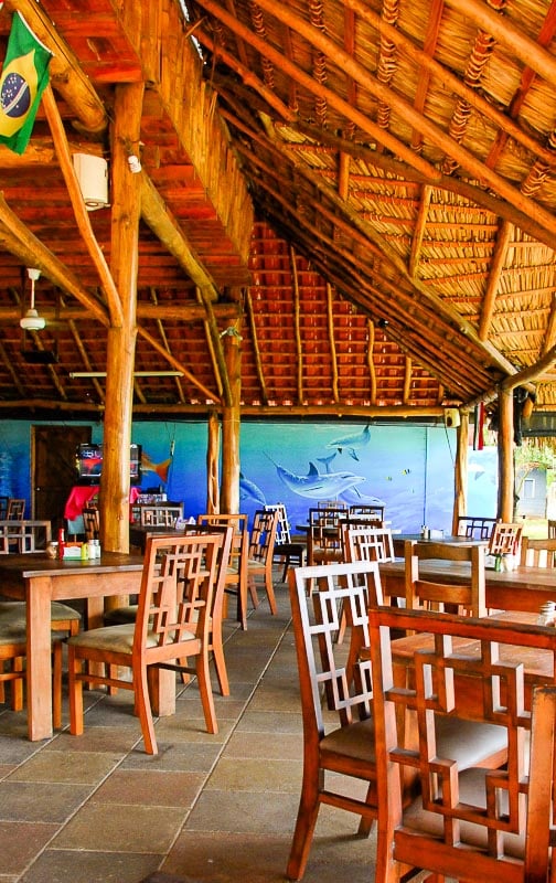 open air wood restaurant with dolphin mural in Costa Rica