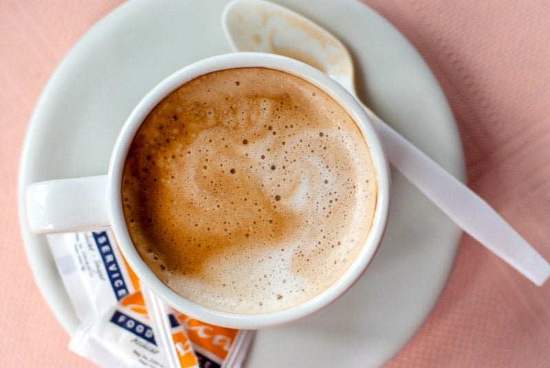 freshly brewed cup of Costa Rican coffee with sugar packets