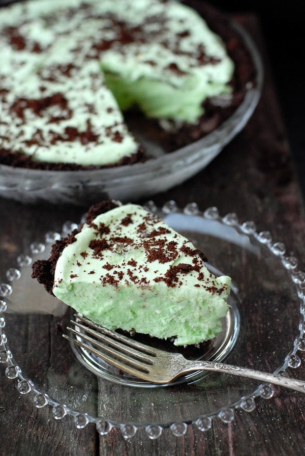 Slice of Grasshopper Pie with pie pan in background