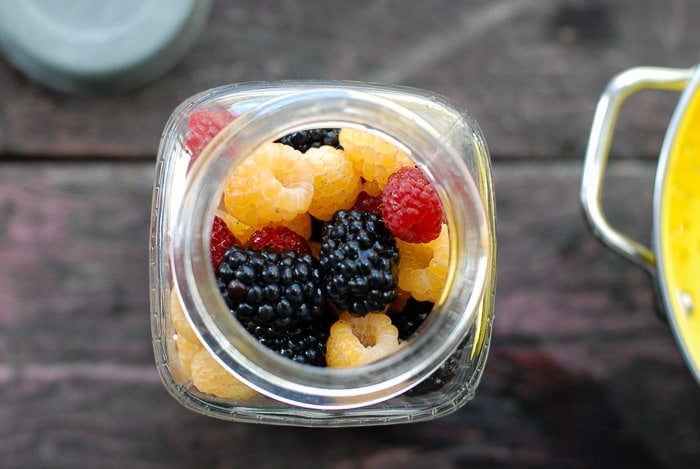 mixed raspberries in jar