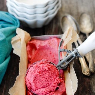 Plum Rosemary-Gin Sorbet in a metal pan with ice cream scoop