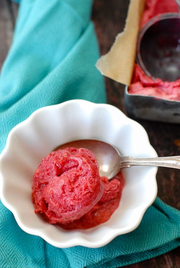 Plum Rosemary-Gin Sorbet in a bowl with spoon