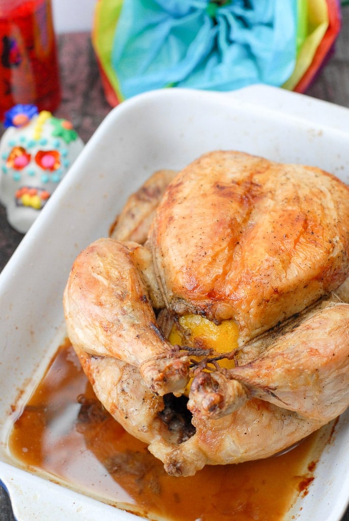 whole roast chicken in roasting pan
