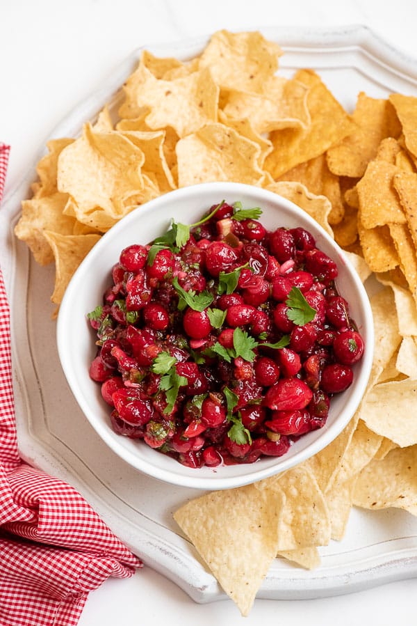 Cranberry Salsa with cilantro leaves and tortilla chips