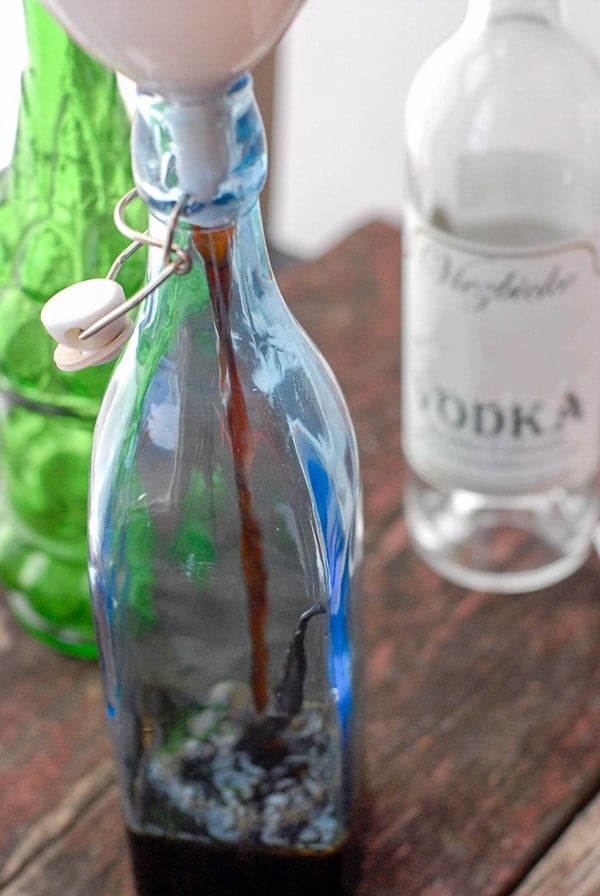 Homemade Coffee Liqueur steps pouring into a gift bottle