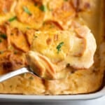 chipotle scalloped sweet potatoes scooped into serving spoon