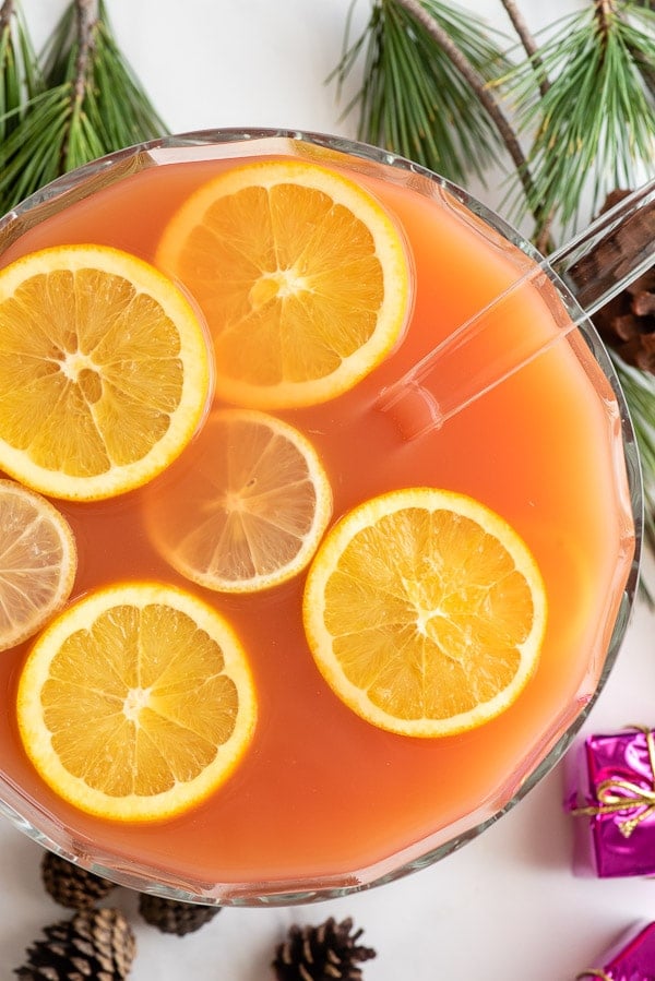 Wassail in punch bowl with citrus slices