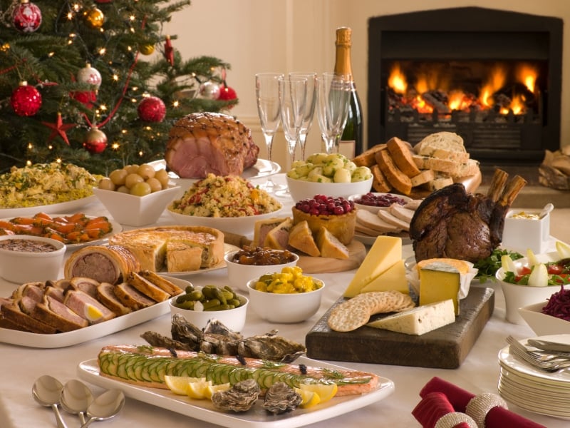 A table full of food, with Holiday and Christmas Day