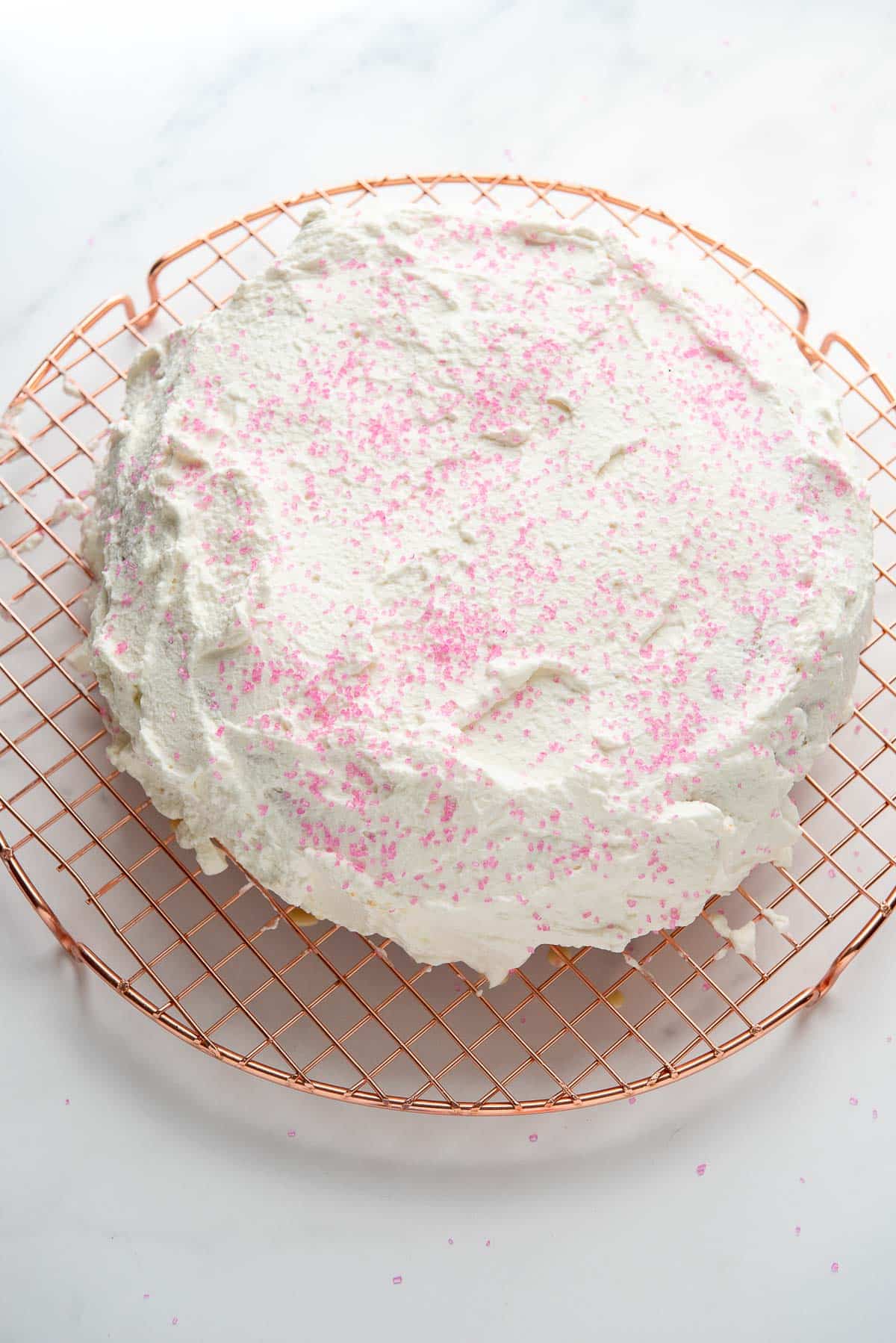 tres leches cake with pink sprinkles