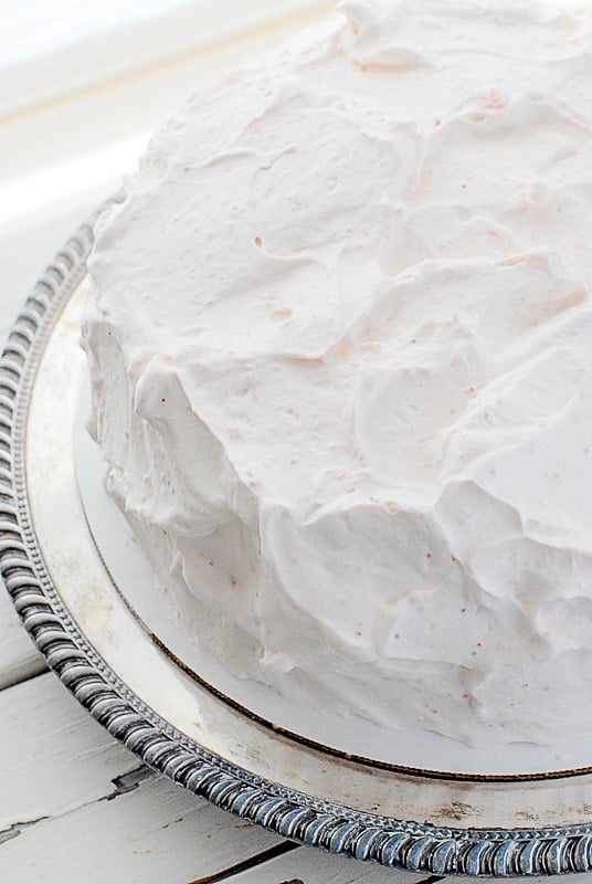 happy day cake frosted with strawberry whipped cream frosting