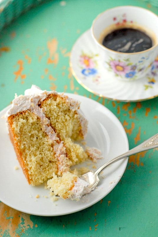 slice of Happy Day Cake with strawberry whipped cream frosting