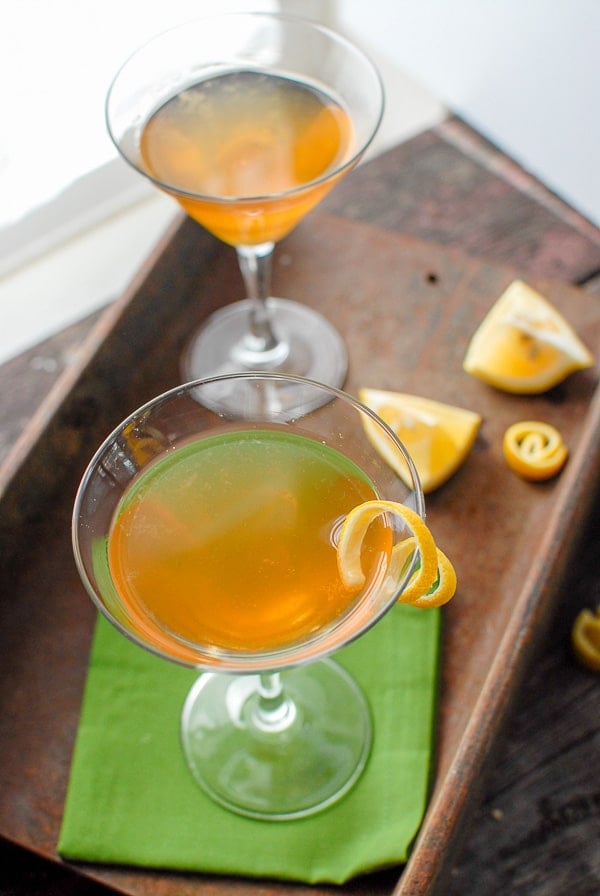 two Leap Year cocktails in martini glasses with lemon