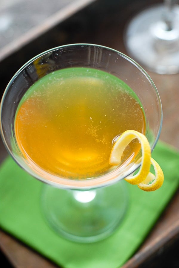 leap year cocktail overhead with lemon spiral