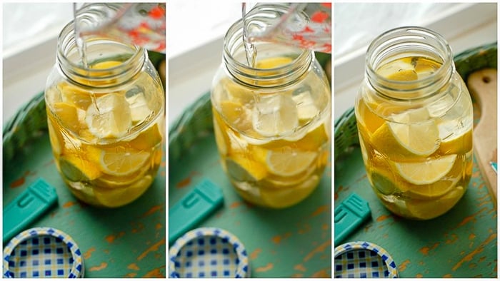 Lemons in jar with vodka infusing 