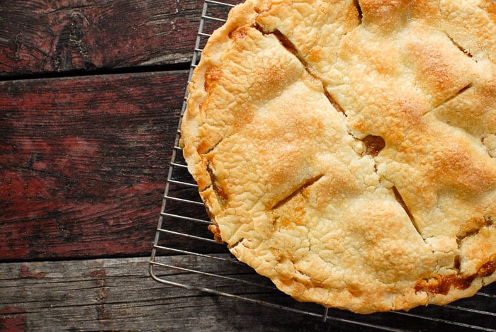 golden brown crust of pear pie on cooling rack