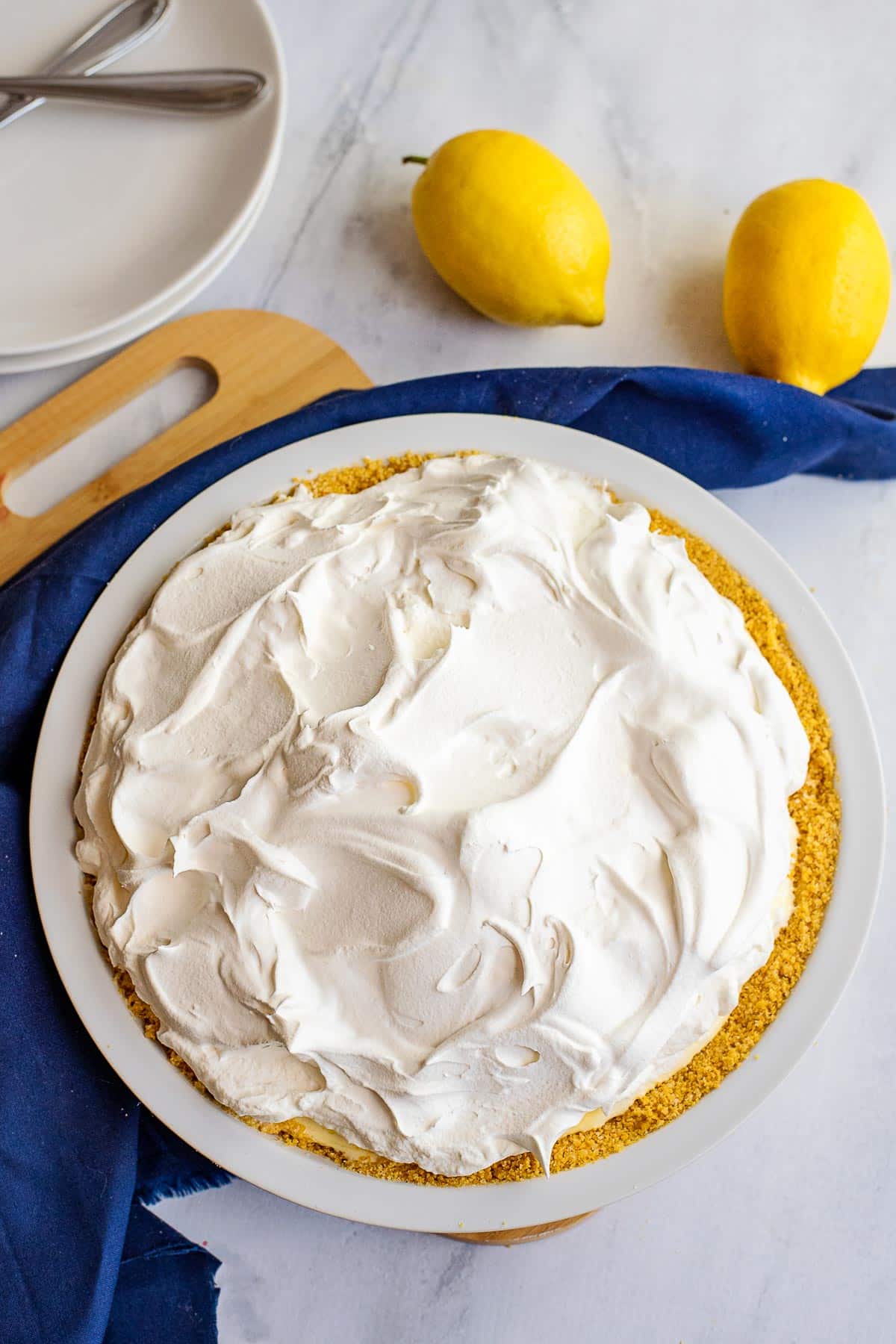 lemon chiffon pie topped with whipped cream