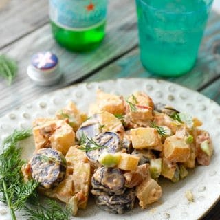 Tri Color Chipotle Bacon Potato Salad on a white ceramic plate