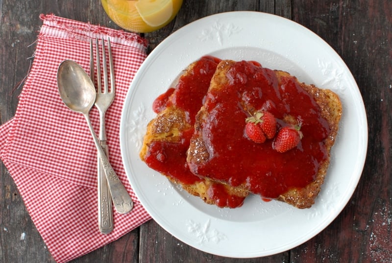 peanut butter french toast and strawberry syrup on white plate