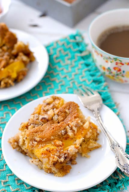 small white plate of Fresh Peach Sour Cream Coffee Cake