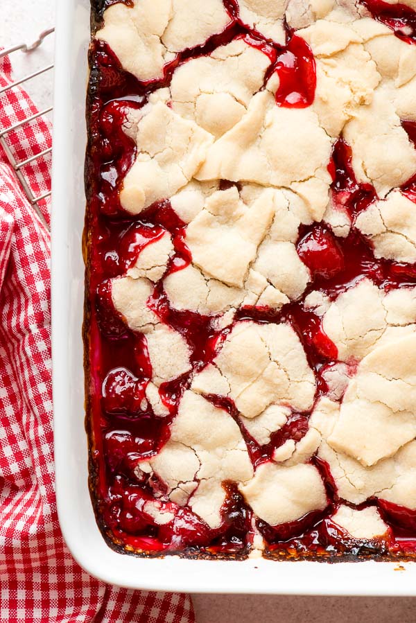Ruby red fresh from the oven Raspberry Pandowdy, an Americana dessert, in a white baking pan