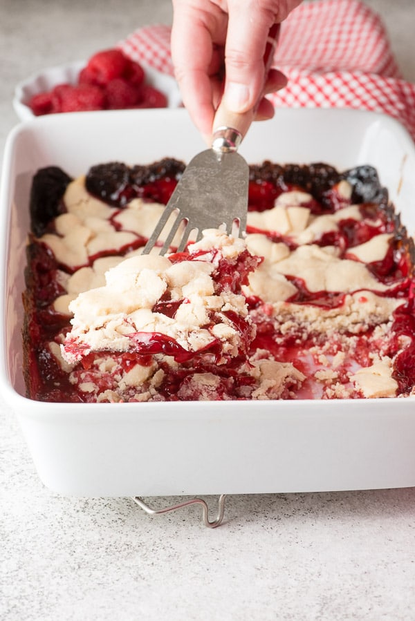 A single scoop of freshly baked gluten-free Raspberry Pandowdy