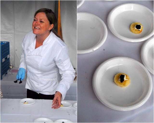 A person standing to plated appetizers