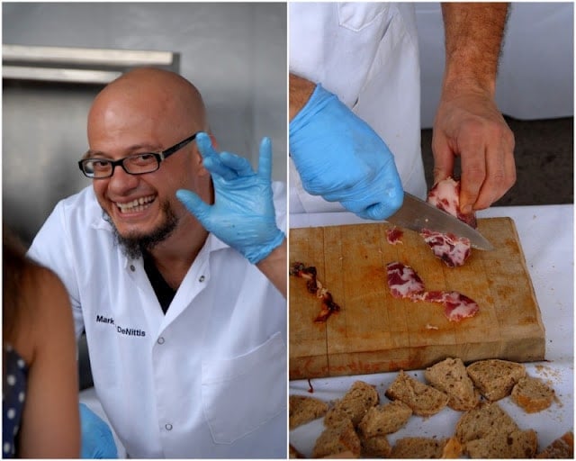 A man cutting food on a table