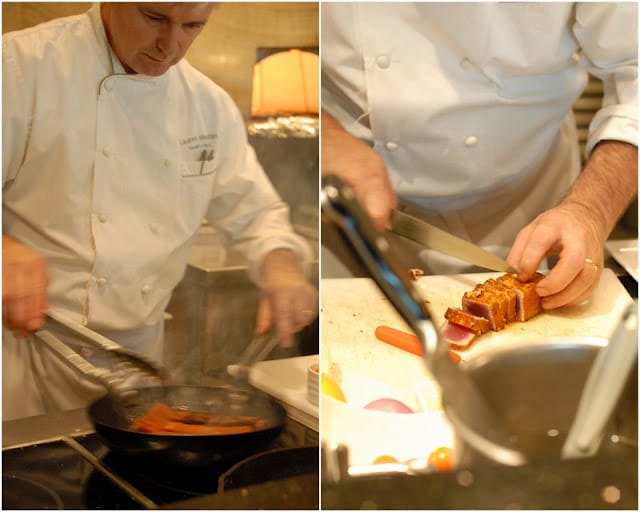 A chef cooking in a kitchen preparing food