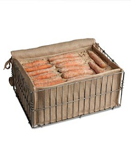 A close up of a box with carrots in root cellar