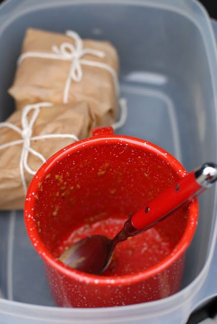 empty red enamel cup with spoon