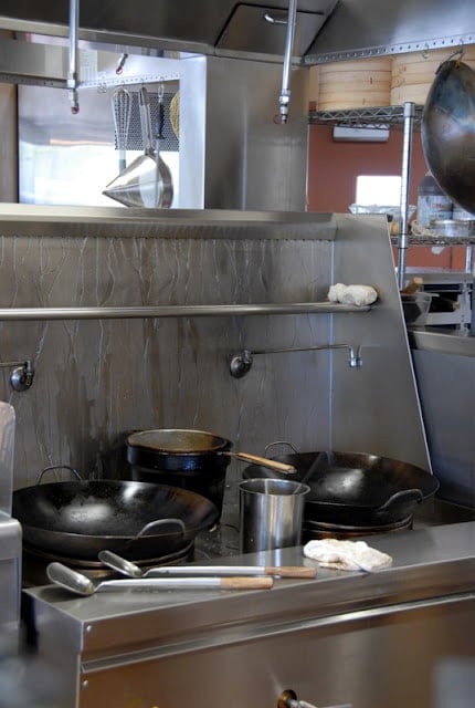 A kitchen with a stove and a sink