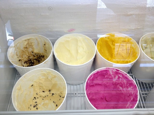 A bowl filled with different types of food on a table, with Ice cream