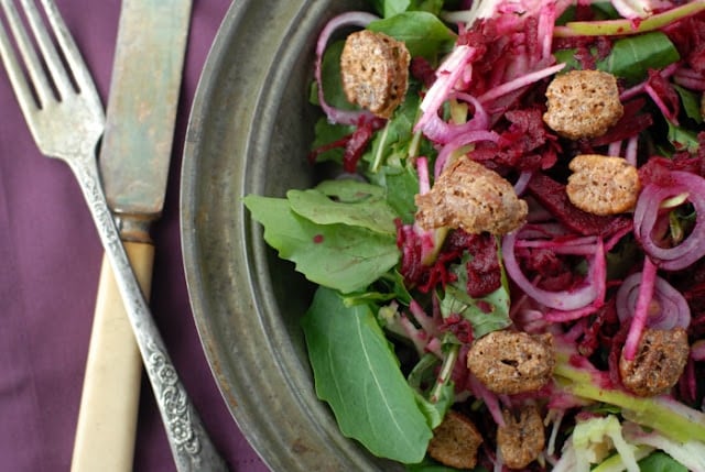 A plate of salad and a fork, with Apple and Pecan