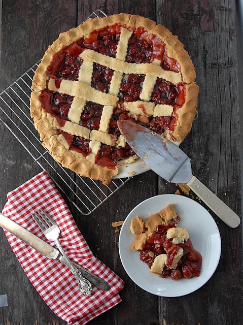 cherry pie and slice on plate