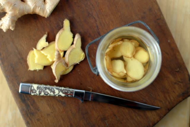 sliced ginger in jar with vodka