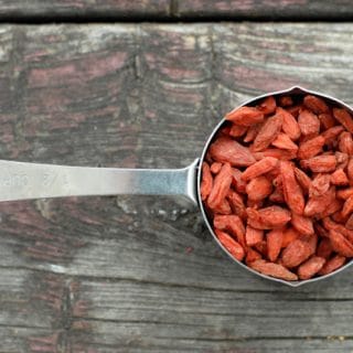 Goji berries in measuring cup