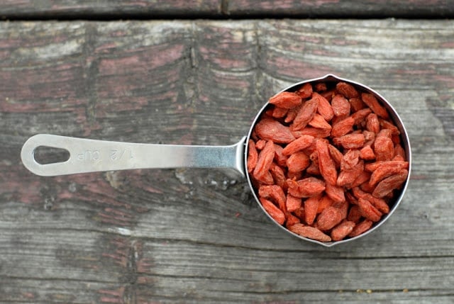 Goji berries in measuring cup